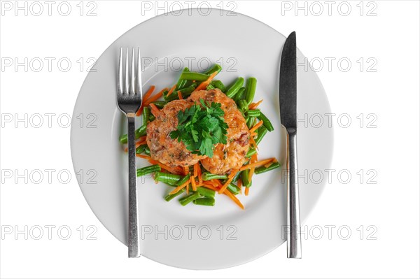 Top view of fish cutlet with green bean and carrot isolated on white