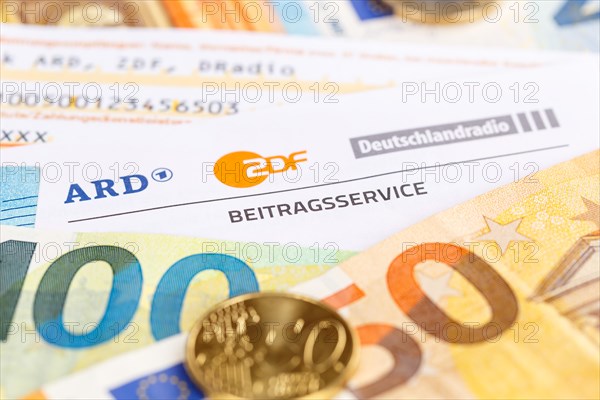 Contribution service of ARD and ZDF Rundfunkgebuehr GEZ with money in Stuttgart