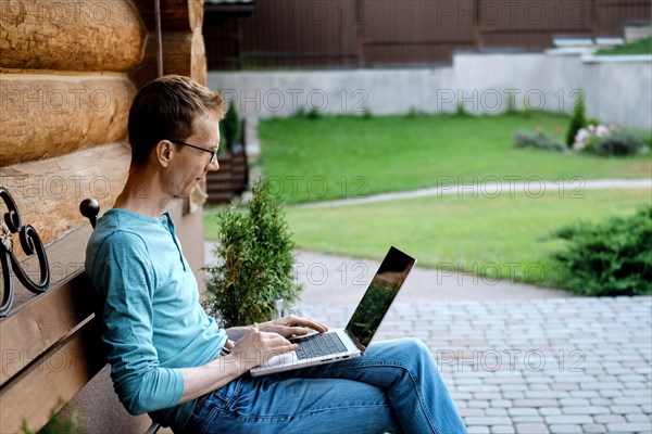 Middle aged man making video call outdoors