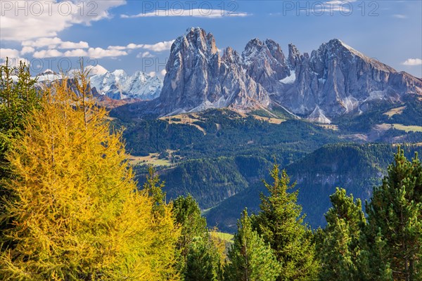 View of the valley with Marmolata 3343m and Sassolungo group 3181m in early autumn