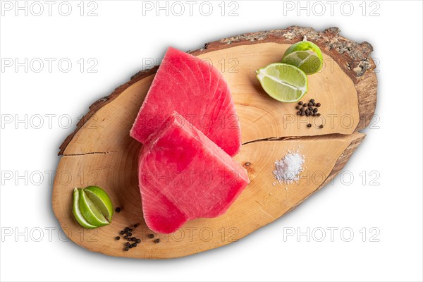 Fresh raw tuna steak on wooden cutting board