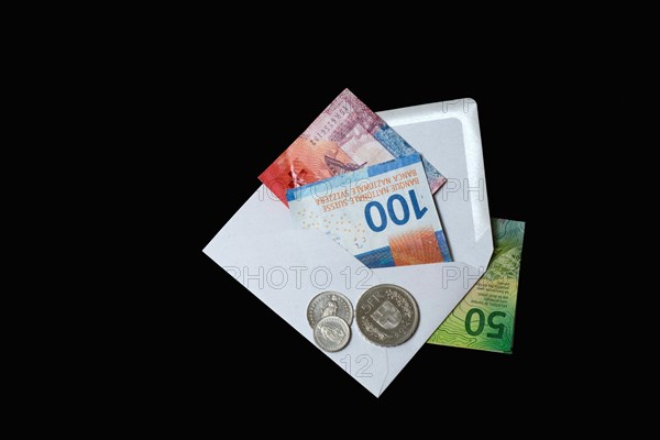 Swiss banknotes and coins with envelope