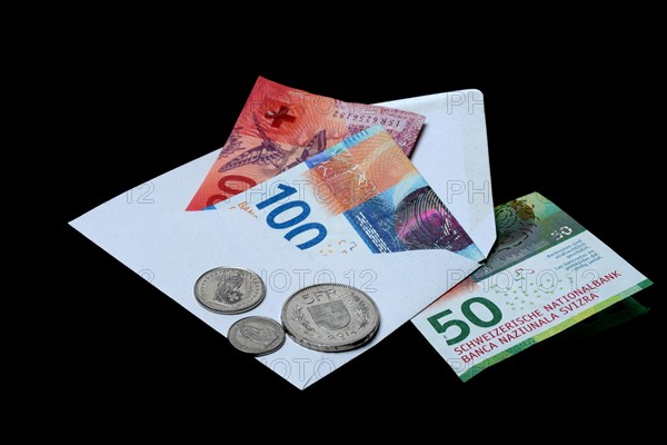 Swiss banknotes and coins with envelope