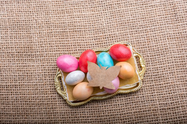 Paper Butterfly on Colorful candy sweets in tray