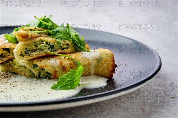 Closeup view of thin crepe stuffed with cheese