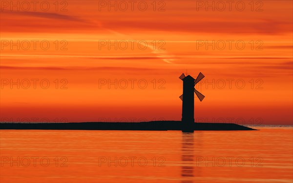 Beautiful sunset with a windmill in the background