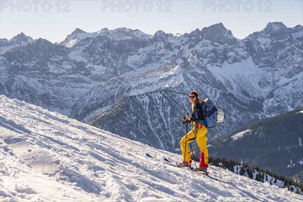 Ski tourer in winter in the snow