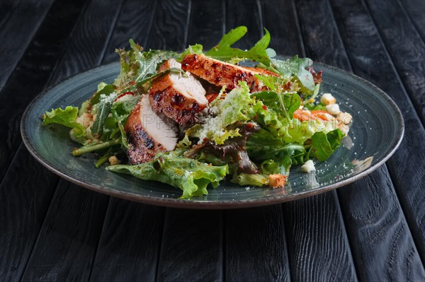 Fried chicken fillet with vegetables and salad dripped with vinegar sauce