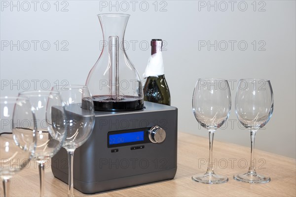 Wine decanter and glasses on kitchen table