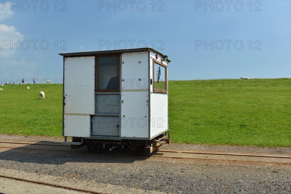 Hallig railway on a dike on the North Sea