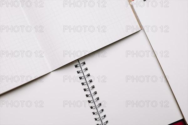 Opened notebooks with white pages