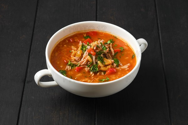 Hot and spicy beef soup with tomato and bell pepper