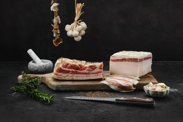 Two types of salted pork belly lard on cutting board