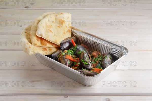 Baked oysters covered with bannock