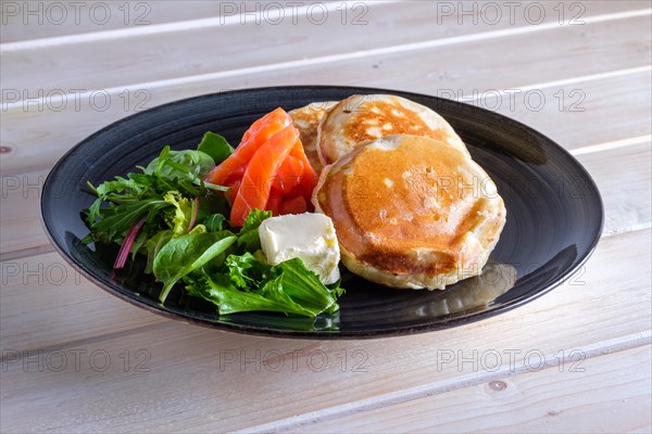 Flapjacks with salmon and fresh salad