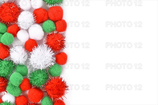 Fluffy round pompons in traditional Christmas colors red