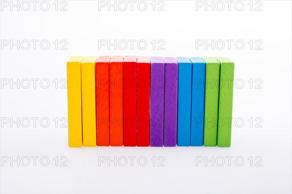 Colorful Domino Blocks in a line on a white background