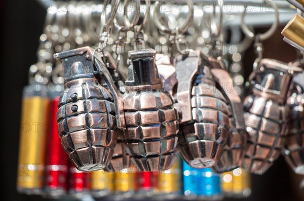 Miniature grenade shaped keychain in the view