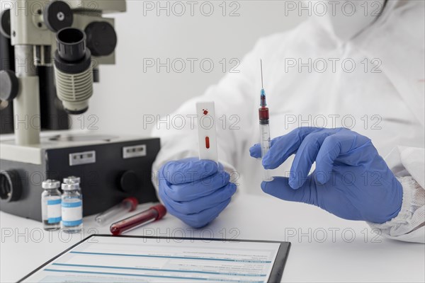 Close up doctor holding blood sample