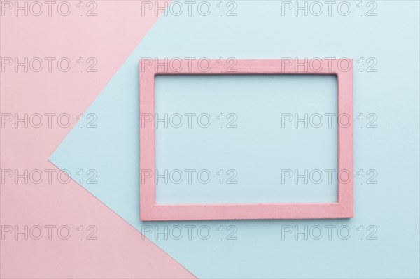 Flat lay beautiful pink wooden frame concept