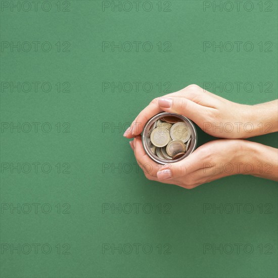 Person holding jar with coins with copy space. Resolution and high quality beautiful photo