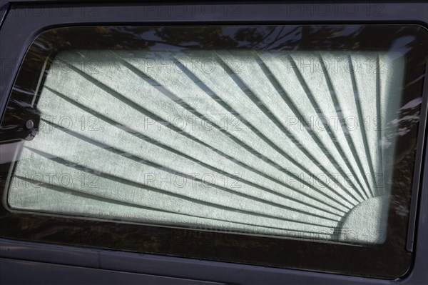 Car window with curtain on a hearse