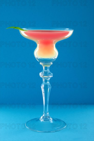 Classic Scofflaw cocktail on blue background
