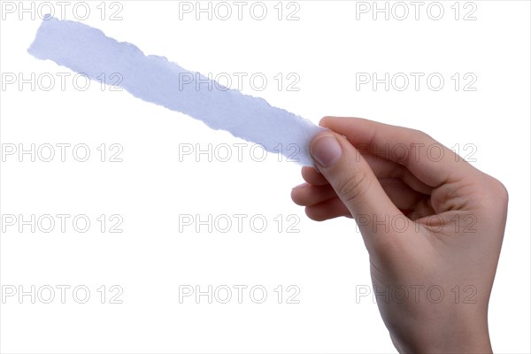 Hand holding a piece of blank torn notepaper