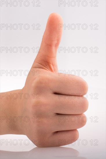 Hand making a good gesture on a white background