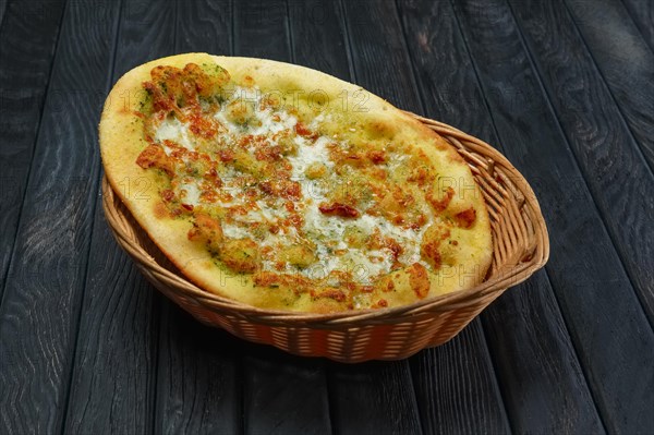 Hot ficaccia in basket on Hot focaccia in basket on table