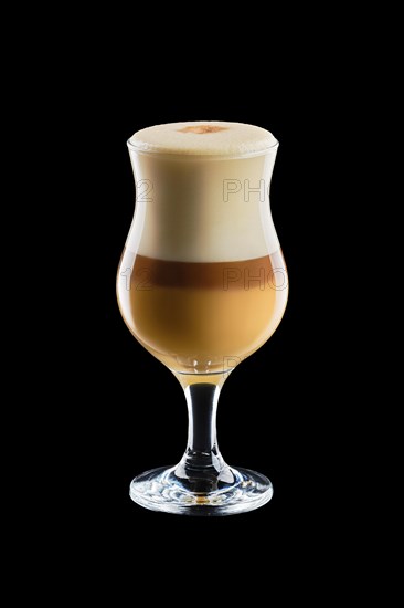 Big transparent glass with layered latte isolated on black background