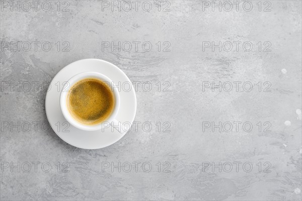 Overhead view of porcelain cup of strong coffee
