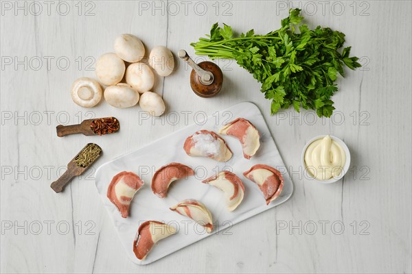 Top view of frozen semifinished dumplings stuffed with mushrooms