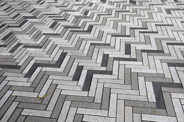 Creative structure with paving stones on sidewalk