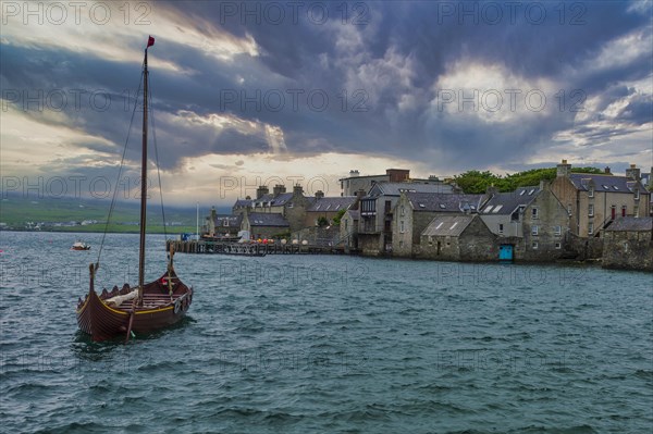 Old viking boat before the seafront of Lerwick