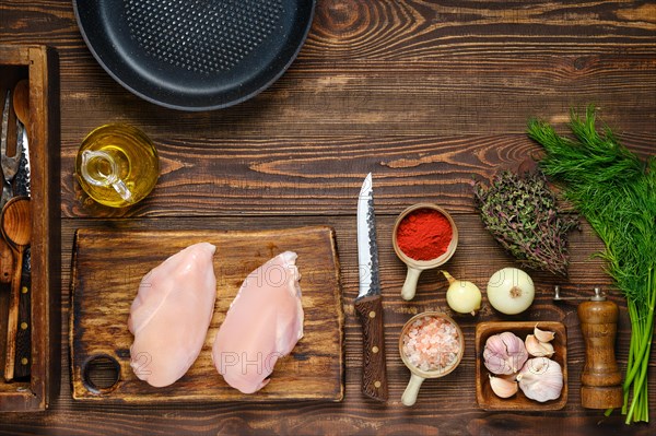 Culinary concept. Top view of kitchen table with chicken fillet