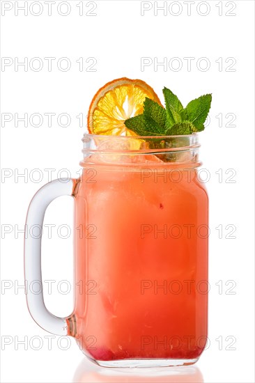 Cold orange and cherry lemonade in mason jar isolated on white background