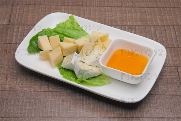 Plate with three kinds of cheese. Cheeseboard