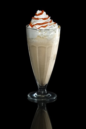 Milkshake caramel summer cocktail isolated on black