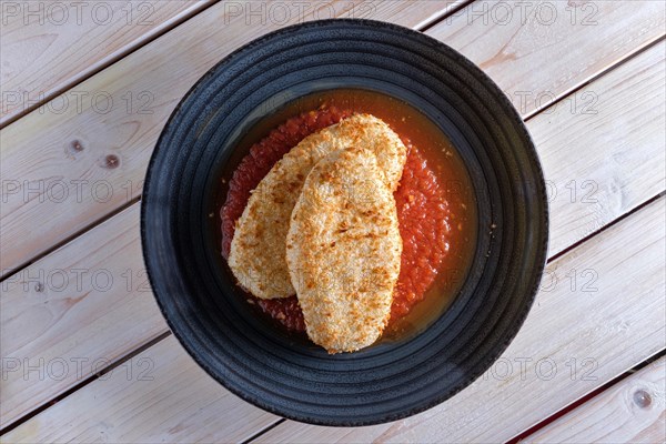 Cutlet in breading with adjika sauce