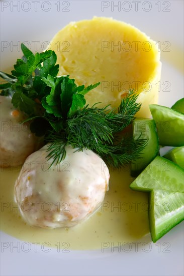 Meatballs with creamy sauce and mashed potato