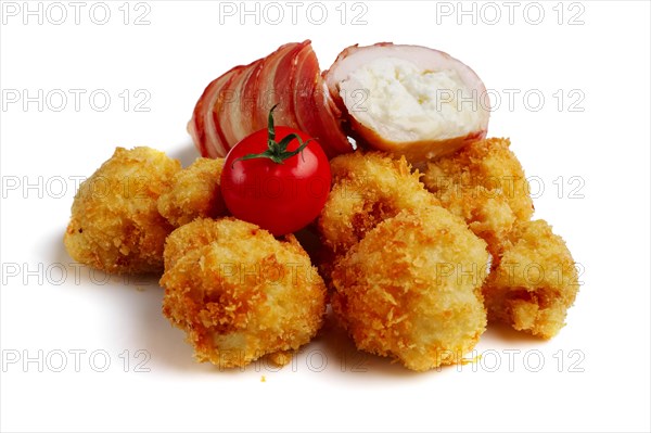 Feta cheese wrapped by bacon and fried in oil with potato in breading