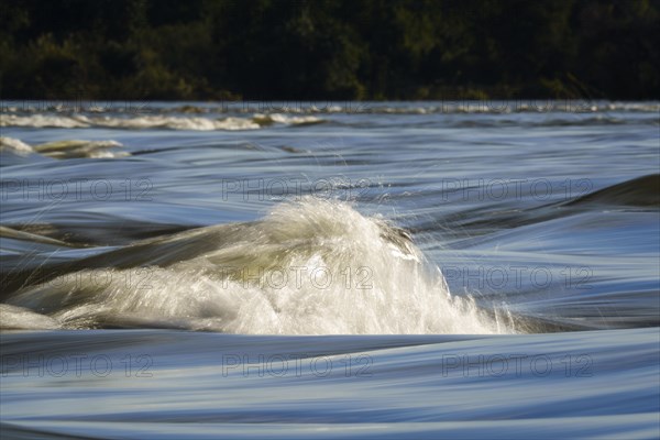 Zambezi river rapids scenery. Display of the rapids foam crown in slow motion. Livingston
