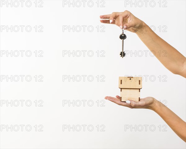 Closeup hands with key cottage