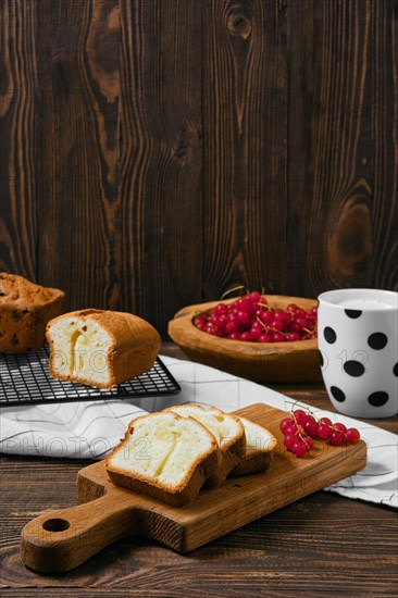 Fresh biscuit cake with apple on wooden table