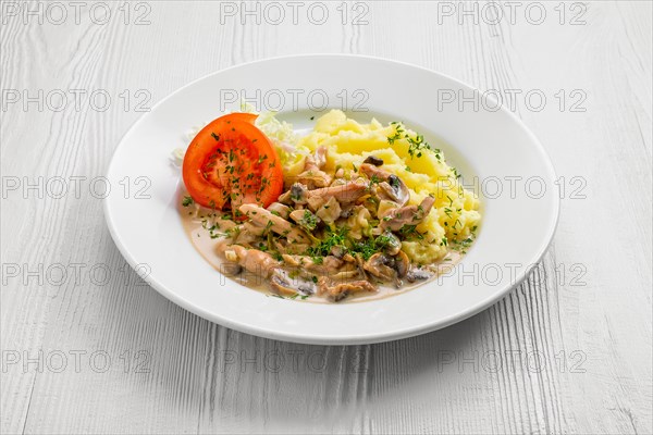 Plate with chicken goulash