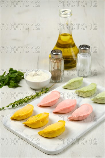 Frozen colorful dumplings with chicken and turkey ground meat