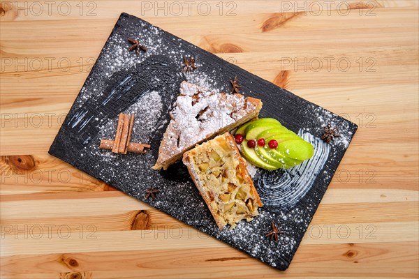 Apple pie on slate plate top view