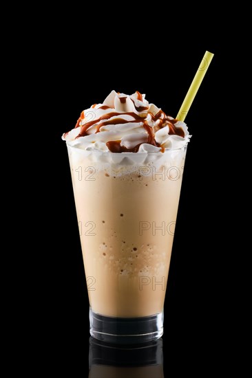 Caramel milkshake isolated on black background