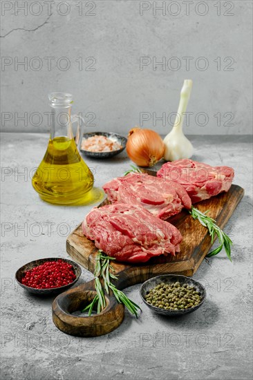 Raw fresh lamb neck cut on slices with spice and herbs